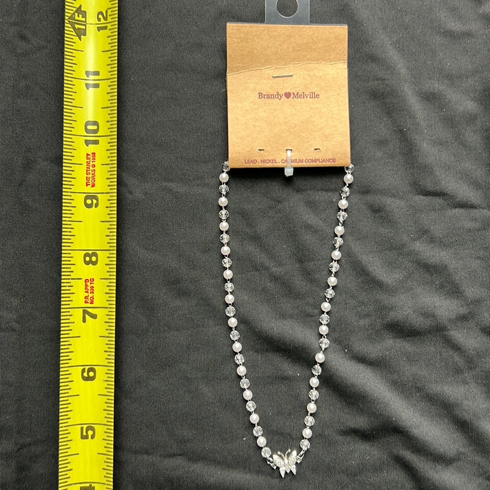 Butterfly and bead necklace.
